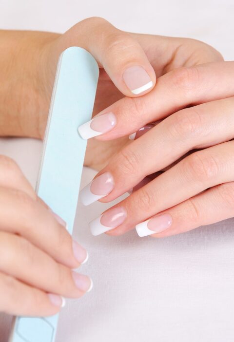 manicurist-doing-polishing-female-fingernails-with-french-manicure manicurist-doing-polishing-female-fingernails-with-french-manicure